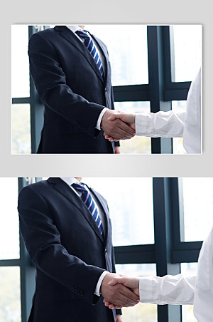 大气西装企业人物握手摄影图