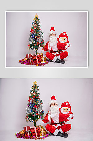 高清圣诞老人单手抱娃娃摄影图