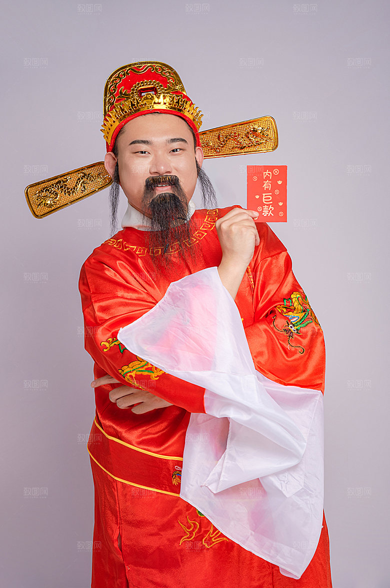 喜庆财神爷拿红包人物摄影图片