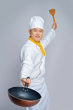 餐饮厨师服拿锅人物摄影图片