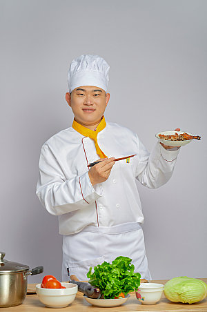餐饮厨师服人物吃烤鸭摄影图片