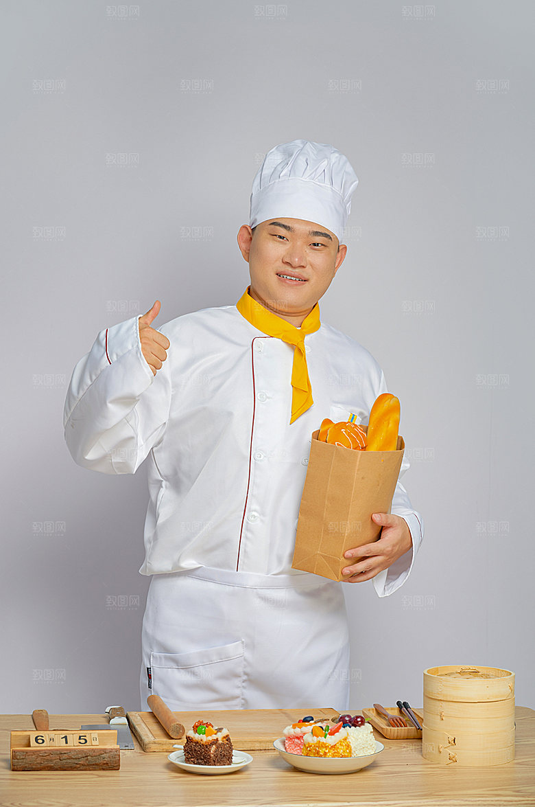 餐饮厨师服人物拿面包摄影图片