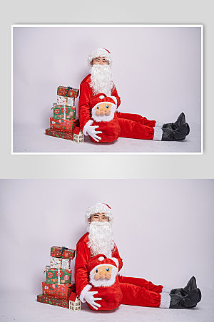 圣诞节圣诞老人坐着手抱礼物盒图