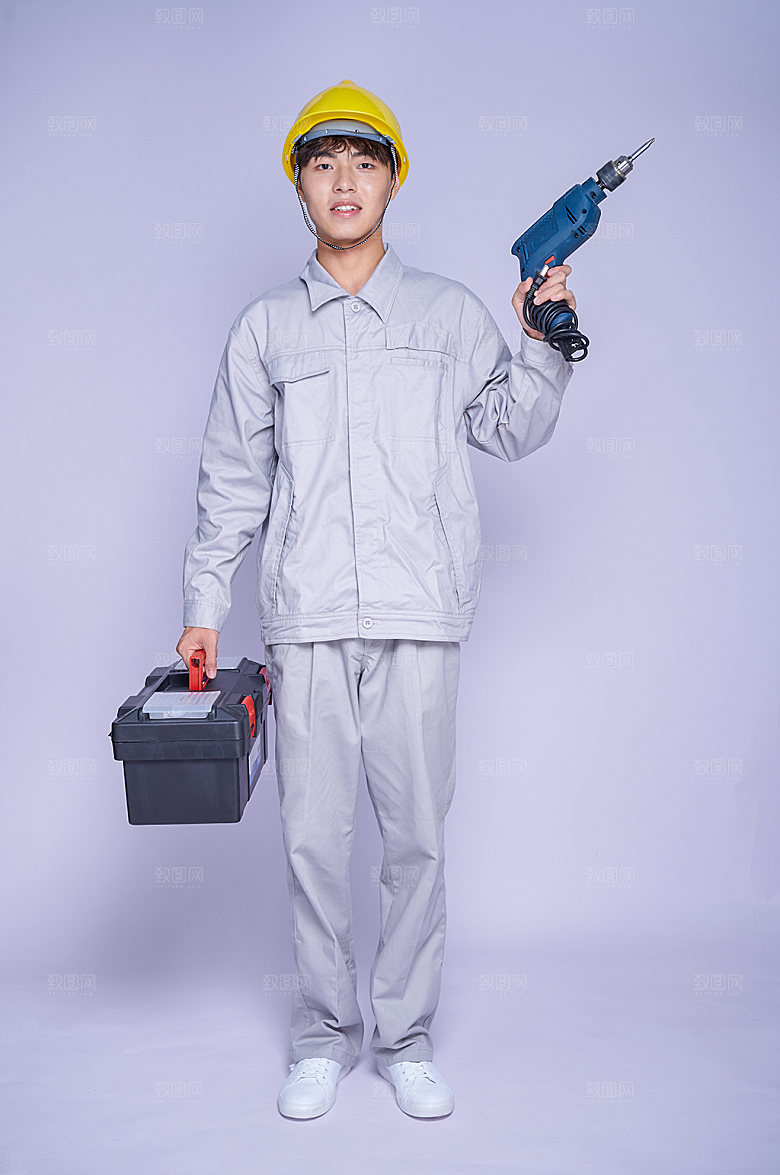 电钻工人提工具箱商业摄影图片