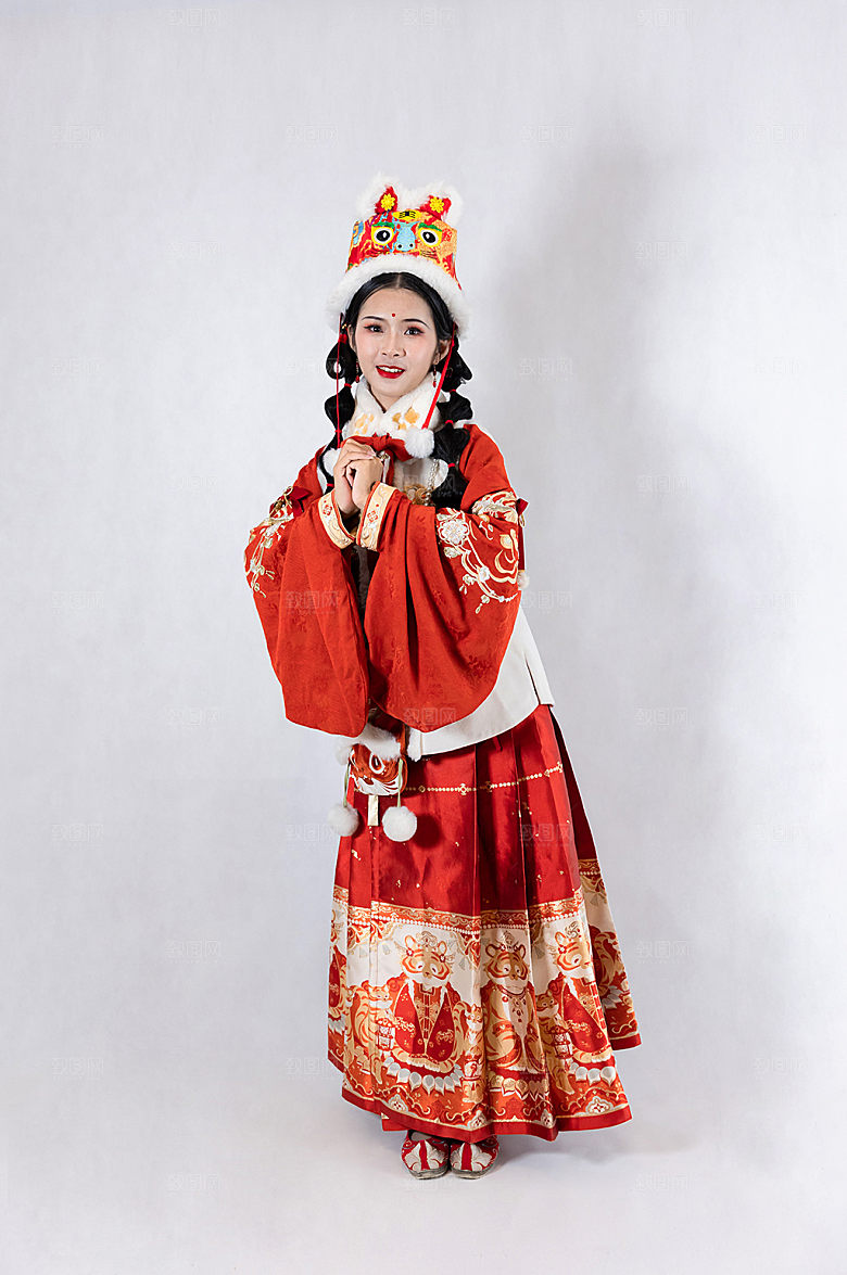喜庆新年女生恭喜手势人物摄影图