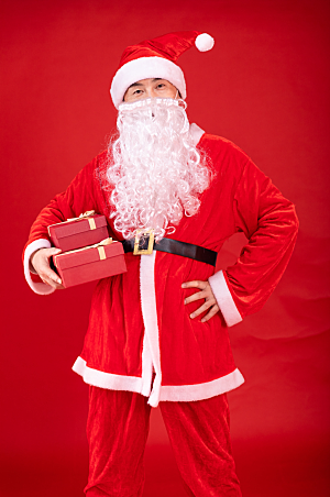 红色创意送礼物圣诞老人摄影图