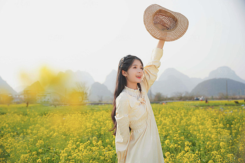油菜花春天少女摄影图