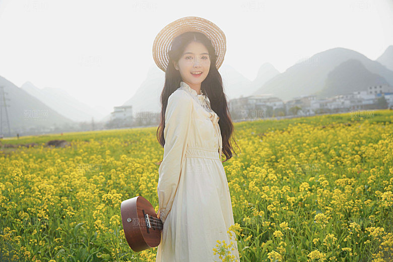 油菜花少女唯美摄影图