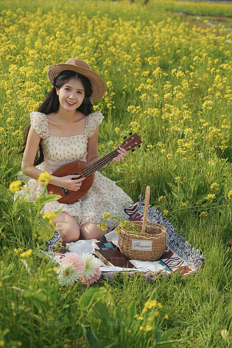 小清新少女油菜花野餐摄影图