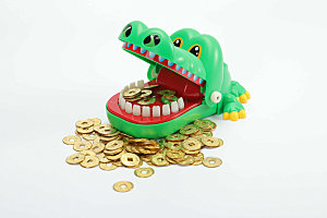 鳄鱼金币金融风险摄影图