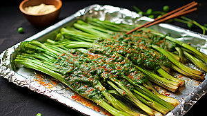 烤韭菜美味蔬菜摄影图