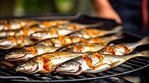烤秋刀鱼海鲜烧烤摄影图