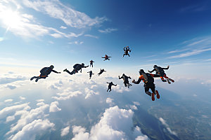 多人跳伞高空运动团队配合摄影图