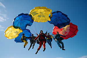 多人跳伞极限运动团队协作摄影图