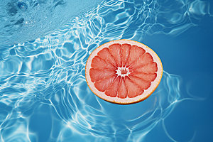 水中柑橘清爽西柚摄影图