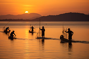 海边赶海日出日落滩涂赶海摄影图