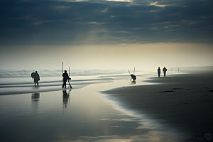 海边赶海日出日落钓鱼摄影图
