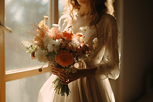 新娘手捧花婚礼花卉摄影图