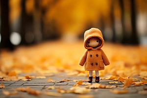 羊毛毡女孩落叶秋季摄影图