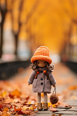 羊毛毡女孩落叶秋天摄影图