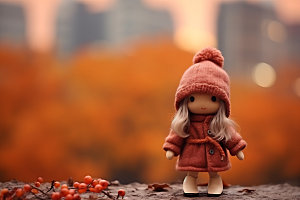 羊毛毡女孩秋季落叶摄影图