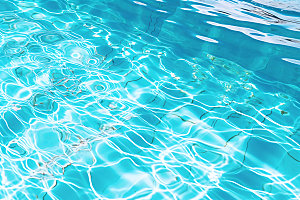 蓝色游泳池泳池水面水波纹摄影图