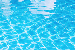 蓝色游泳池高清泳池水面摄影图